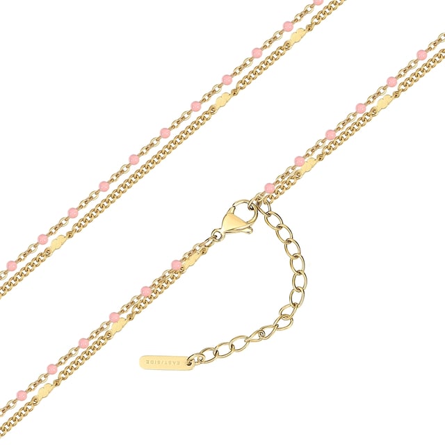 Do you like wearing accessories that not everyone has? Then you will like this necklace from the EAST/SIDE label! Elegant design meets a modern mix of materials: The double-row chain combines a delicate anchor chain and a solid curb chain, both made of 14-carat yellow gold-plated stainless steel. Upbeat enamel beads add small splashes of color to the décolleté and exude cheerful boho vibes - a feel-good accessory that doesn't just round off festival outfits. The high robustness and ease of care of stainless steel ensure that it is suitable for everyday use. Thanks to the carabiner clasp with extension chain, the length of the chain can be adjusted quickly and easily.