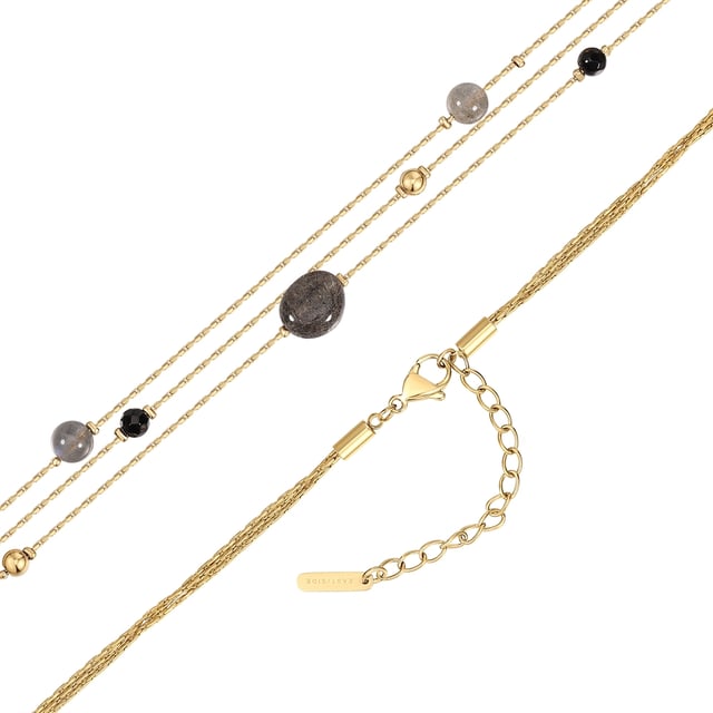 Do you like stylish fashion jewelry with a wow factor? Then this bracelet from the EAST/SIDE label is made for you! It surrounds your wrist in several rows and relies on the magical magic of gemstones: three link chains are combined with round-cut amethyst stones and stainless steel beads - an eye-catcher that is also comfortable to wear. All stainless steel elements are robust, water-resistant and easy to care for and finished with classic 14-carat yellow gold plating. An extension chain with a lobster clasp ensures quick putting on and taking off and easy length adjustment.