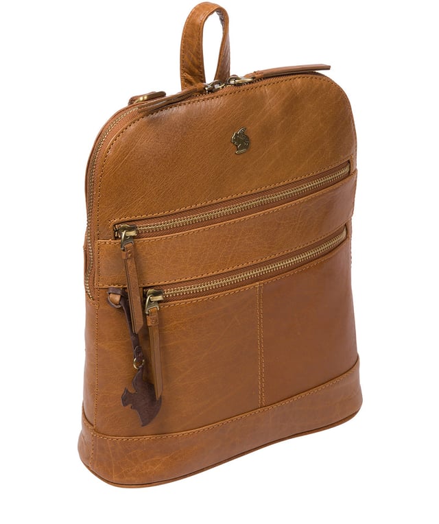 Handcrafted from natural leather for a beautifully textured finish the 'Francisca' backpack from Conkca London features plentiful on-the-go storage. The main zipped compartment comes lined with natural and untreated 100% cotton with two interior pockets, ideal for a smartphone and keys. Dual zips on the front of the backpack provide extra storage solutions. Comes with adjustable and durable fabric shoulder straps finished with the inimitable Conkca squirrel logo and charm.