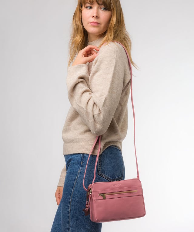 The 'Drew' cross-body bag from Concka London is crafted from full grain genuine leather that has a beautiful finish. The dual zip pockets featured on this accessory make organisation that a little bit easier. Lined with 100% untreated cotton and comes with an adjustable matching leather strap, which has a maximum drop length of 70cm. Finished with a zipped pocket to the front adorned with the cute Conkca London squirrel zip pull and an embossed Conkca London logo.