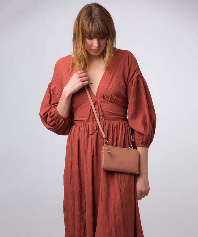 The perfect cross-over design, the 'Winnie' takes the classic purse design and transforms it into the perfect occasion accessory. This simply elegant design from Conkca's Signature Collection tansforms from crossbody and clutch bag with ease thanks to the detachable and adjustable slim leather strap with a maximum drop length of 75cm. Not forgetting the storage, with 16 card slots which line the 100% cotton interior and are concealed by a unique zip-round design.
