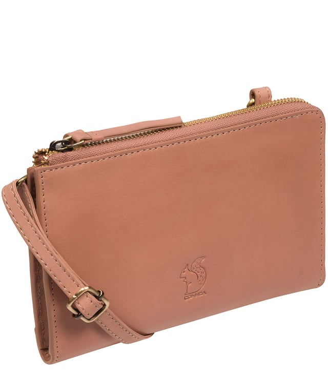 The perfect cross-over design, the 'Winnie' takes the classic purse design and transforms it into the perfect occasion accessory. This simply elegant design from Conkca's Signature Collection tansforms from crossbody and clutch bag with ease thanks to the detachable and adjustable slim leather strap with a maximum drop length of 75cm. Not forgetting the storage, with 16 card slots which line the 100% cotton interior and are concealed by a unique zip-round design.