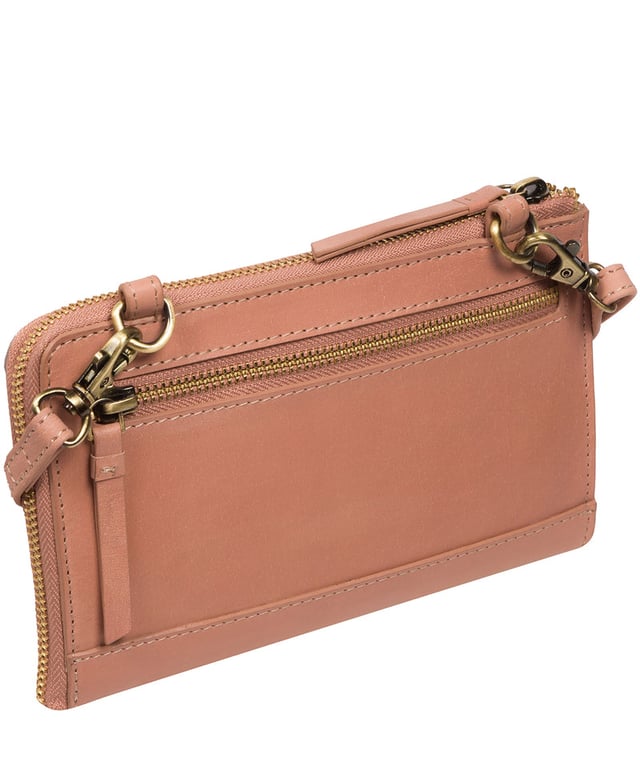 The perfect cross-over design, the 'Winnie' takes the classic purse design and transforms it into the perfect occasion accessory. This simply elegant design from Conkca's Signature Collection tansforms from crossbody and clutch bag with ease thanks to the detachable and adjustable slim leather strap with a maximum drop length of 75cm. Not forgetting the storage, with 16 card slots which line the 100% cotton interior and are concealed by a unique zip-round design.