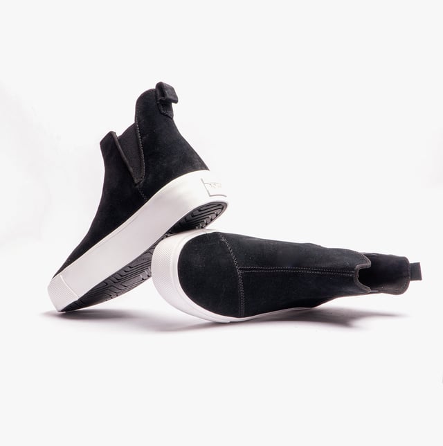 Elevate your style effortlessly with the Fenix, a mid-top Chelsea slip-on boot designed for modern flair and comfort. Featuring premium suede uppers and distinctive zig-zag stitch details, this boot blends fashion with functionality. Dual elastic gore panels ensure easy on and off, while OrthoLite Eco LT Hybrid insoles, made with 26% eco content, provide cushioned support with an environmentally friendly touch. The platform vulcanized rubber sidewall and durable rubber outsole offer stability and durability, making the Fenix your go-to for a stylish and comfortable step up.- Leather upper- Slip-on fit - Cushioned footbed- Durable rubber outsole- Toms branding