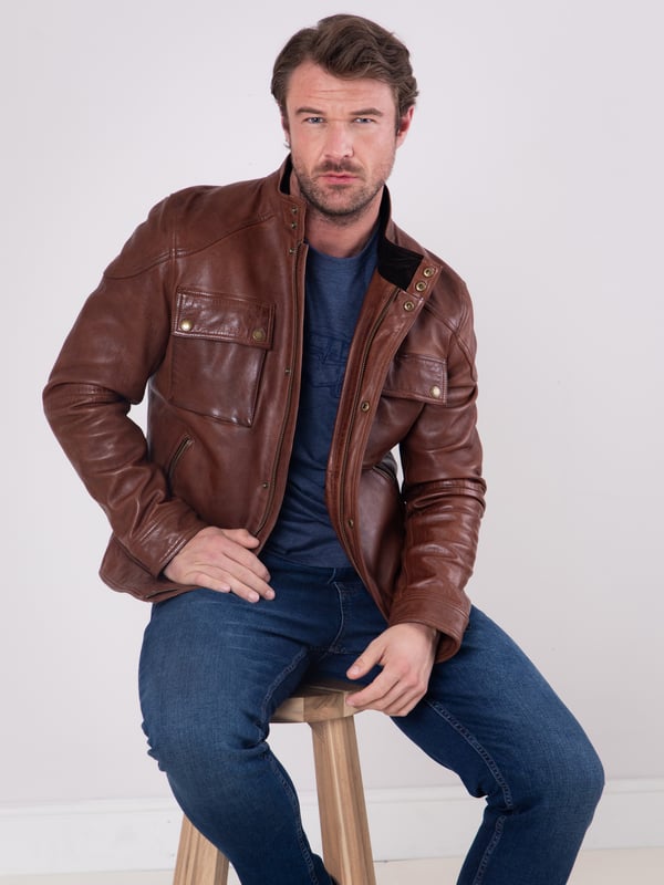 Expertly crafted from fine aniline leather, the Burnmoor jacket exudes rugged sophistication. This classic jacket features a concealed centre zip fastening with a press stud placket, as well as press stud and zip pockets for stylish practicality. Shoulder panel detailing and branded brass-tone hardware complete this timeless look.