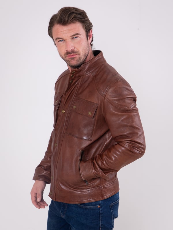 Expertly crafted from fine aniline leather, the Burnmoor jacket exudes rugged sophistication. This classic jacket features a concealed centre zip fastening with a press stud placket, as well as press stud and zip pockets for stylish practicality. Shoulder panel detailing and branded brass-tone hardware complete this timeless look.