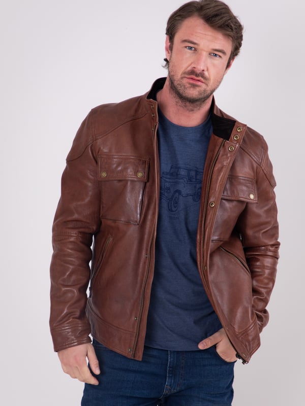 Expertly crafted from fine aniline leather, the Burnmoor jacket exudes rugged sophistication. This classic jacket features a concealed centre zip fastening with a press stud placket, as well as press stud and zip pockets for stylish practicality. Shoulder panel detailing and branded brass-tone hardware complete this timeless look.