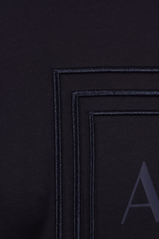 Armani Exchange Jersey T-shirt in Deep Navy
Elevate your casual wardrobe with the Armani Exchange Deep Navy Jersey T-Shirt. Crafted from 100% mercerised cotton, this regular-fit tee offers a refined take on everyday comfort. The mercerised treatment provides a subtle sheen and enhanced durability, ensuring a luxurious feel that lasts.
 
Designed for effortless style, this t-shirt features a classic round neck and short sleeves, making it a versatile staple for any occasion. The deep navy hue exudes sophistication, while the iconic Armani Exchange logo on the chest adds a touch of modern branding.
 
Features

Premium Mercerised Cotton: 100% cotton fabric with a polished finish and increased strength.
Classic Regular Fit: Comfortable and flattering silhouette.
Armani Exchange logo on the chest 
Deep Navy Color
Style code: XM000358