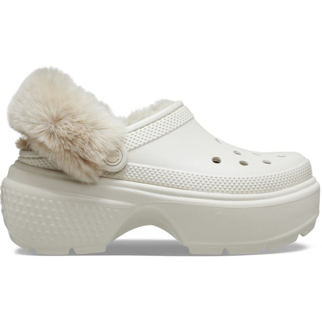 Experience unmatched comfort with these clogs, boasting excessively chunky soles that give you a 5.5cm / 2.1-inch heel height for added style. Their lightweight construction ensures all-day wearability, and the fully lined interior keeps your feet cosy. Plus, the fuzz-wrapped pivotable backstrap enhances both the look and feel of these exceptional clogs. Jibbitz™ holes makes it easy to personalise.