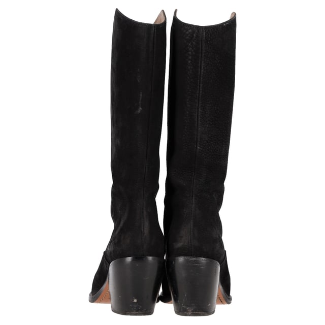 VINTAGE, RRP AS NEW
The Chloé Western Cowboy Boots in black leather and suede are a stylish and bold twist on a classic design. Combining rich black leather with soft suede accents, these boots feature iconic Western-inspired details, including subtle stitching and a pointed toe. The stacked heel provides added height while maintaining comfort, making these boots perfect for both day and night wear. With their unique mix of textures and timeless design, they are a statement piece that adds edge and sophistication to any outfit.

Styling Tip:
Pair the Chloé Western Cowboy Boots with a flowy midi skirt or dress for a chic, bohemian-inspired look. These boots also look great with skinny jeans or tailored trousers for an effortlessly cool, everyday outfit. Add a leather jacket or a fringed cardigan for a complete Western-inspired ensemble. The black leather and suede combination gives these boots versatility, allowing them to seamlessly fit into both casual and more elevated outfits.

Chloé Western Cowboy Boots in Black Leather and Suede

Condition: Very good
Signs of wear: Minor markings, Lightly used but very well maintained. Minor mark at soles & creasing, light scuffing at the soles and heels.
Packaging: None
Color: Black
Material: Leather | leather
Size: EU | 38.5
Measurements: Heel height: 80; Insole length: 250
SKU: NAPPUGBSH457154W