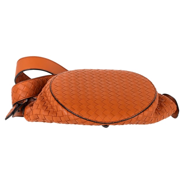 VINTAGE, RRP AS NEW
The Bottega Veneta Intrecciato Tambura Handbag in brown leather is a stunning example of the brand's signature craftsmanship and understated luxury. Expertly woven using the iconic Intrecciato technique, this Italian-made handbag features top handles and a detachable, adjustable shoulder strap for versatile wear. With its sleek, modern design and two-way zip fastening, it’s the perfect blend of sophistication and practicality for any occasion.

with Dust bag

Bottega Veneta Intrecciato Tambura Handbag in Brown Leather
Condition: Excellent
Signs of wear: No retail tag, No visible sign of wear., 
Packaging: Dust bag
Color: Brown
Material: Leather | leather
Size: One Size | One Size
Measurements: Width: 200; Height: 180; Length: 280; Handle drop: 110; Strap length: 0
SKU: NAPPUGBBA447438W