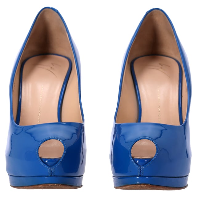 VINTAGE, RRP AS NEW
The Giuseppe Zanotti Peep-Toe Pumps in Blue Patent Leather exude bold sophistication and modern luxury. Crafted from high-shine blue patent leather, these pumps feature a sleek peep-toe design and a stiletto heel, offering a perfect blend of elegance and edge. The striking blue hue adds a pop of color to any outfit, while the iconic Giuseppe Zanotti craftsmanship ensures a comfortable fit and lasting style. These pumps are the ideal choice for making a statement at any event.

Styling Tip: Pair these stunning pumps with tailored black trousers and a crisp white shirt for a refined, fashion-forward look. For a more relaxed outfit, combine them with dark denim and a fitted jacket for a modern, casual chic vibe. The bold blue color makes them a statement piece, so keep accessories minimal and let the shoes do the talking.

 Giuseppe Zanotti Peep-Toe Pumps in Blue Patent Leather

Condition: Very good
Signs of wear: No visible sign of wear. No Mark at insole., Lightly used but very well maintained. Minor mark at soles & creasing, light scuffing at the soles and heels.
Packaging: Dust bag
Color: Blue | blue
Material: Leather | patent leather
Size: IT | 39
Measurements: Heel height: 120; Insole length: 250
SKU: NAPPUDESH457672W