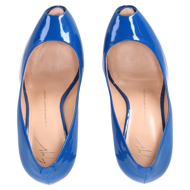 VINTAGE, RRP AS NEW
The Giuseppe Zanotti Peep-Toe Pumps in Blue Patent Leather exude bold sophistication and modern luxury. Crafted from high-shine blue patent leather, these pumps feature a sleek peep-toe design and a stiletto heel, offering a perfect blend of elegance and edge. The striking blue hue adds a pop of color to any outfit, while the iconic Giuseppe Zanotti craftsmanship ensures a comfortable fit and lasting style. These pumps are the ideal choice for making a statement at any event.

Styling Tip: Pair these stunning pumps with tailored black trousers and a crisp white shirt for a refined, fashion-forward look. For a more relaxed outfit, combine them with dark denim and a fitted jacket for a modern, casual chic vibe. The bold blue color makes them a statement piece, so keep accessories minimal and let the shoes do the talking.

 Giuseppe Zanotti Peep-Toe Pumps in Blue Patent Leather

Condition: Very good
Signs of wear: No visible sign of wear. No Mark at insole., Lightly used but very well maintained. Minor mark at soles & creasing, light scuffing at the soles and heels.
Packaging: Dust bag
Color: Blue | blue
Material: Leather | patent leather
Size: IT | 39
Measurements: Heel height: 120; Insole length: 250
SKU: NAPPUDESH457672W