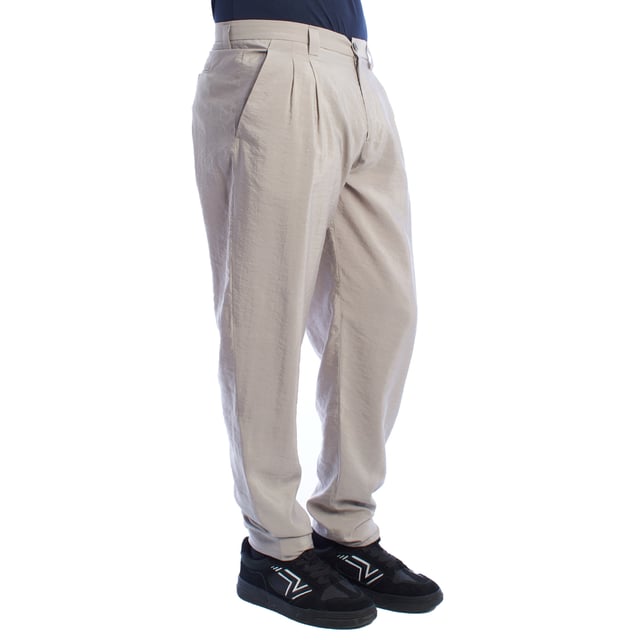 Chino pants from Emporio Armani, designed for those looking for a perfect combination of elegance and contemporary style.

 Characteristics:

 - Fit: Tapered fit, with front darts that add structure and a comfortable fit at the top, narrowing towards the ankles for a modern and streamlined silhouette.
 - Closure: Button and zipper, ensuring practicality and ease of use.

 Pockets:

 - Two functional side pockets.
 - Back welt pockets with button closure highlight the clean and sophisticated design.

 - Style: Minimalist and versatile design, ideal for combining on casual or semi-formal occasions.

 A pair of trousers that stands out for its impeccable and refined workmanship, perfectly adapting to the modern man.
 Composition: Fabric: 76% Silk, 24% Polyamide
 Care:
- Machine wash on gentle cycle.
 - Use similar colors in the wash.
 - Avoid the use of bleaches.
 - Dry at low temperature in the dryer.
 - Iron at low temperature.
 - Do not dry clean.