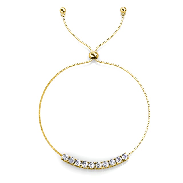 Samenstelling: Messing Afwerking: 18k verguld Steensoort: Oostenrijks kristal Steensoort: Witte zirkoon Aantal stenen (stuks): 86 Steenkleur: Kristal Lengte ketting: Lengte ketting (mm): 400 + 50 Diameter oorbellen (mm): 14 Lengte armband (mm): 245