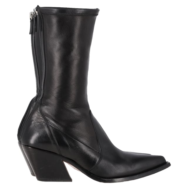 VINTAGE, RRP AS NEW
The Givenchy Slant-Heel Mid-Calf Boots in black leather are a bold and modern statement piece that combines luxury with contemporary edge. Crafted from smooth black leather, these boots feature a distinctive slanted heel that adds a unique architectural element to their sleek design. The mid-calf length offers versatility, making them perfect for both casual and dressed-up looks. With their refined silhouette and edgy details, these boots are ideal for those who want to elevate their footwear collection with a touch of sophistication and attitude.

Styling Tip:
Pair the Givenchy Slant-Heel Mid-Calf Boots with tailored trousers or a midi skirt for a chic and balanced look. For a more casual vibe, wear them with skinny jeans or a leather jacket. These boots also pair perfectly with a sleek, form-fitting dress, adding a strong contrast that brings an edgy element to a feminine silhouette. Whether dressed up or down, the unique slanted heel is sure to make a stylish statement wherever you go.

 Givenchy Slant-Heel Mid-Calf Boots in Black Leather

Condition: Very good
Signs of wear: Minor markings, Lightly used but very well maintained. Minor mark at soles & creasing, light scuffing at the soles and heels.
Packaging: None
Color: Black
Material: Leather | leather
Size: IT | 39
Measurements: Heel height: 60; Insole length: 250
SKU: NAPPUGBSH457178W