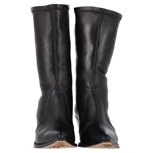 VINTAGE, RRP AS NEW
The Givenchy Slant-Heel Mid-Calf Boots in black leather are a bold and modern statement piece that combines luxury with contemporary edge. Crafted from smooth black leather, these boots feature a distinctive slanted heel that adds a unique architectural element to their sleek design. The mid-calf length offers versatility, making them perfect for both casual and dressed-up looks. With their refined silhouette and edgy details, these boots are ideal for those who want to elevate their footwear collection with a touch of sophistication and attitude.

Styling Tip:
Pair the Givenchy Slant-Heel Mid-Calf Boots with tailored trousers or a midi skirt for a chic and balanced look. For a more casual vibe, wear them with skinny jeans or a leather jacket. These boots also pair perfectly with a sleek, form-fitting dress, adding a strong contrast that brings an edgy element to a feminine silhouette. Whether dressed up or down, the unique slanted heel is sure to make a stylish statement wherever you go.

 Givenchy Slant-Heel Mid-Calf Boots in Black Leather

Condition: Very good
Signs of wear: Minor markings, Lightly used but very well maintained. Minor mark at soles & creasing, light scuffing at the soles and heels.
Packaging: None
Color: Black
Material: Leather | leather
Size: IT | 39
Measurements: Heel height: 60; Insole length: 250
SKU: NAPPUGBSH457178W