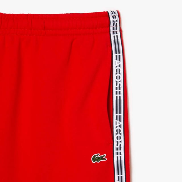 Men's Lacoste Cotton Flannel Shorts.- Regular fit, straight cut: Timeless.- Branded drawstring at waist: Adjustable. It's all in the details.- Side pockets, branded stripe down sides: Little details that make a big difference.- Embroidered crocodile on front: Our authentic signature.- Brushed cotton flannel with fleece lining: Super-soft. Material: 80% Cotton, 20% Polyester. Ref: GH5074S5H.