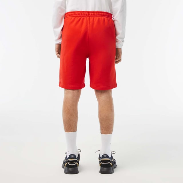 Men's Lacoste Cotton Flannel Shorts.- Regular fit, straight cut: Timeless.- Branded drawstring at waist: Adjustable. It's all in the details.- Side pockets, branded stripe down sides: Little details that make a big difference.- Embroidered crocodile on front: Our authentic signature.- Brushed cotton flannel with fleece lining: Super-soft. Material: 80% Cotton, 20% Polyester. Ref: GH5074S5H.