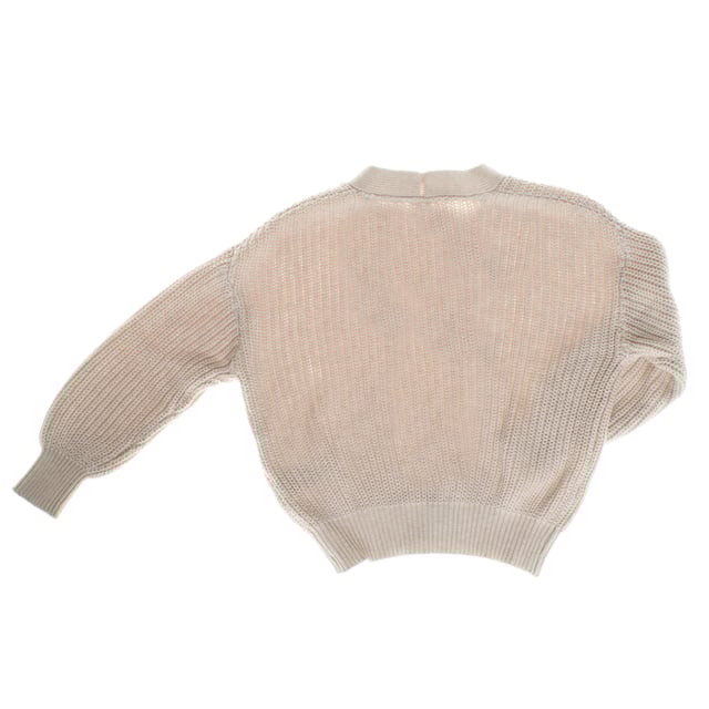 This girl's sweater combines style and comfort in a modern garment.

 Crafted from soft cotton, it features a wide ribbed pattern that adds texture to the design.

 The deep V-neckline and large buttons in a mottled colour give it a distinctive and elegant touch.

 The long dropped sleeves and cropped cut with elasticated cuffs ensure a comfortable and modern fit, ideal for complementing any stylish casual outfit.
 Composition: 100% Cotton
 Care:
- Machine wash cold.
 - Use mild detergents.
 - Do not use a dryer.
 - Iron at low temperature.
 - Do not dry clean.
