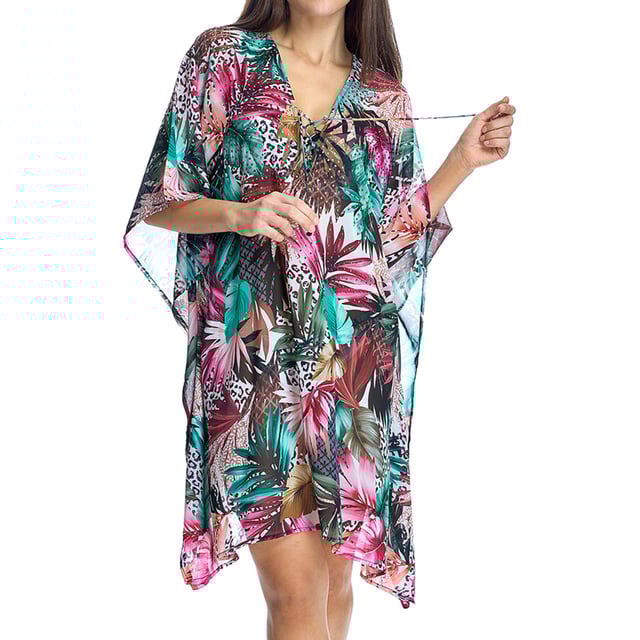 A perfect design to complement days at the beach or pool, this women's caftan stands out for its comfort and elegance. The tropical print with a vibrant mix of colors provides a fresh and dynamic touch, ideal for those looking to look sophisticated without giving up comfort.

 Details:

 - Loose, flowing design provides a comfortable and flattering fit.
 - Kimono-style French sleeves offer freedom of movement and a sophisticated touch.
 - V-neckline with adjustable decorative bow.
 - Lightweight and breathable fabric with transparency, ideal for warm climates.
 - Vibrant print adds unique style and personality.

 Perfect as an accessory for your swimsuit or bikini, this kaftan is a versatile garment that combines elegance and functionality for days at the beach or pool. A must-have for your summer getaways!
 Composition: 100% Viscose
 Care:
Hand wash.
 Do not use bleach.
 Do not tumble dry.
 Do not iron.
 Do not dry clean.
 Do not squeeze.