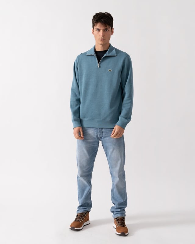Ribbed cotton interlock
Zip ribbed stand up polo collar
Tone-on-tone ribbed finishes at bottom of garment and sleeve ends
Classic Fit
Embroidered green crocodile on chest
Cotton (100%)