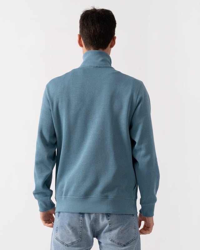 Ribbed cotton interlock
Zip ribbed stand up polo collar
Tone-on-tone ribbed finishes at bottom of garment and sleeve ends
Classic Fit
Embroidered green crocodile on chest
Cotton (100%)