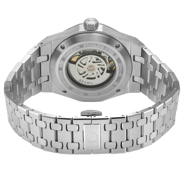 The Gevril Gotham Men’s Watch is a bold celebration of luxury and urban sophistication, drawing inspiration from the exclusive Gotham neighborhood and its prestigious Park Row district. Known for its stately architecture and as a haven for New York’s elite, Park Row epitomizes a legacy of wealth, power, and refinement—qualities embodied in this remarkable timepiece. Crafted with meticulous attention to detail, the Gotham Watch features a 41mm round case, accentuated by a rich top ring that evokes the gleam of opulent cityscapes. The embossed dial, adorned with elegant detailing, mirrors the understated grandeur of Park Row’s historic façades and its harmonious blend of tradition and modernity. A day display positioned at 3 o’clock enhances its practicality, reflecting the precision demanded by those who command time and success. The push/pull hexagon crown, a signature of strength and distinctiveness, and the exhibition case back offer a glimpse into the Swiss-made Sellita SW200-1 automatic movement, a testament to the timepiece's exceptional craftsmanship. The stainless-steel satin bracelet, secured by a deployment buckle, combines durability with an effortless sense of style, reminiscent of the polished sophistication that defines Park Row’s affluence. Protected by an anti-reflective sapphire crystal and water-resistant up to 100 meters, the Gotham Watch is as resilient as the city it represents. It is designed for the discerning gentleman who seeks a timepiece that embodies both function and artistry—a watch that resonates with the rhythm of New York City, where ambition meets elegance. The Gevril Gotham Men’s Watch is more than a timepiece; it is a statement. With every glance, it serves as a reminder of Park Row’s legacy and the wearer’s connection to a world of luxury, power, and prestige.