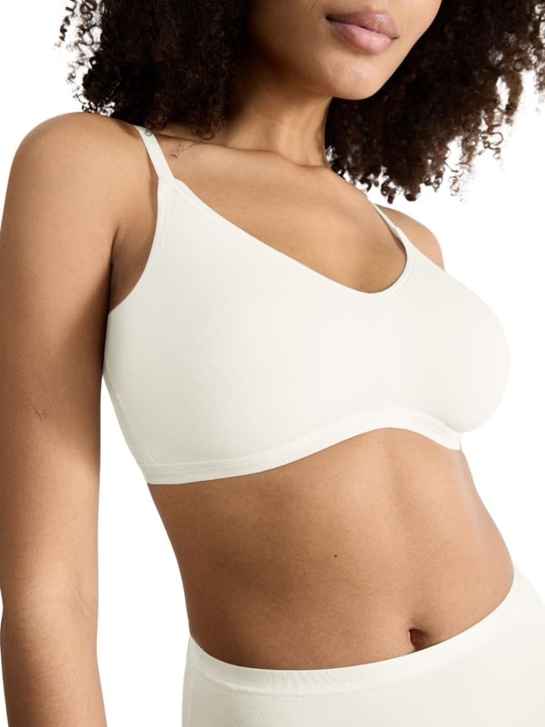 Sloggi GO Daily Cotton Soft Bra. The GO Daily Cotton collection uses certified organic cotton for smooth stretchy everyday underwear. Non-wired soft cup bra with hook & eye closure, adjustable straps and high cotton content. Product is machine washable.