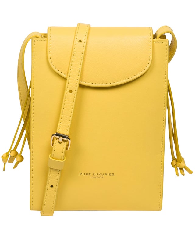 The 'Kiana' cross body phone bag from the Pure Luxuries Marylebone Collection is handcrafted from high-quality, genuine Nappa leather with a natural super-soft touch. The minimalistic fold-over top is secured by a gold-coloured magnetic press stud. This practical design is the perfect place to keep your phone safe and features a tassel design on the exterior. Lined with 100% cotton for a flawless finish and comes with a matching and adjustable slim leather strap with a maximum drop length of 65cm. The minimalist Pure Luxuries logo is embossed in gold foil for a beautifully simple finishing touch.