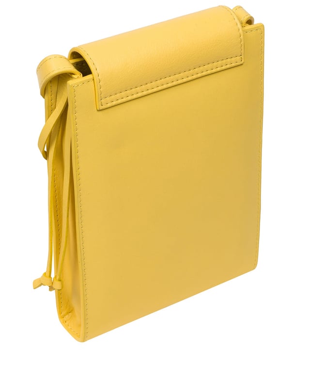 The 'Kiana' cross body phone bag from the Pure Luxuries Marylebone Collection is handcrafted from high-quality, genuine Nappa leather with a natural super-soft touch. The minimalistic fold-over top is secured by a gold-coloured magnetic press stud. This practical design is the perfect place to keep your phone safe and features a tassel design on the exterior. Lined with 100% cotton for a flawless finish and comes with a matching and adjustable slim leather strap with a maximum drop length of 65cm. The minimalist Pure Luxuries logo is embossed in gold foil for a beautifully simple finishing touch.
