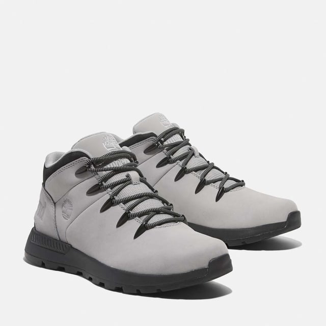 Timberland Sprint Trekker Mid Lace-Up Trainers in grey.- Upper made with Premium Timberland® Leather and ReBOTL™ fabric containing 50% recycled PET plastic.- Lace-up style.- Compression-molded EVA midsole.- OrthoLite® footbed.- ReBOTL™ fabric lining containing 50% recycled PET plastic.- Rubber lug outsole.- Ref: A6DQDEM01