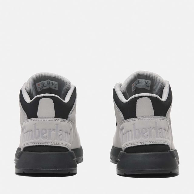 Timberland Sprint Trekker Mid Lace-Up Trainers in grey.- Upper made with Premium Timberland® Leather and ReBOTL™ fabric containing 50% recycled PET plastic.- Lace-up style.- Compression-molded EVA midsole.- OrthoLite® footbed.- ReBOTL™ fabric lining containing 50% recycled PET plastic.- Rubber lug outsole.- Ref: A6DQDEM01