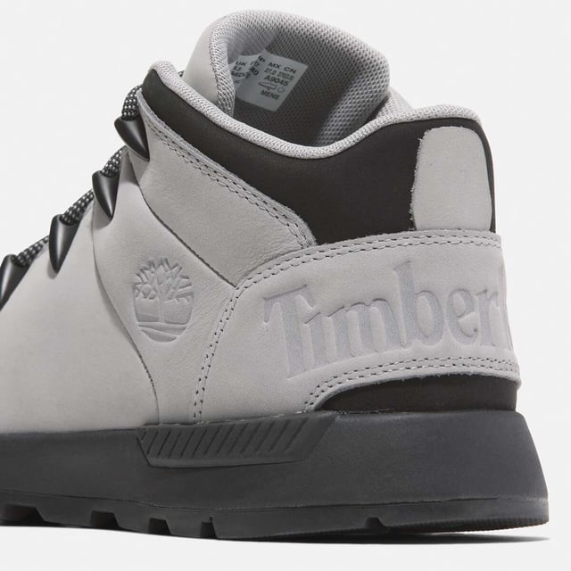 Timberland Sprint Trekker Mid Lace-Up Trainers in grey.- Upper made with Premium Timberland® Leather and ReBOTL™ fabric containing 50% recycled PET plastic.- Lace-up style.- Compression-molded EVA midsole.- OrthoLite® footbed.- ReBOTL™ fabric lining containing 50% recycled PET plastic.- Rubber lug outsole.- Ref: A6DQDEM01