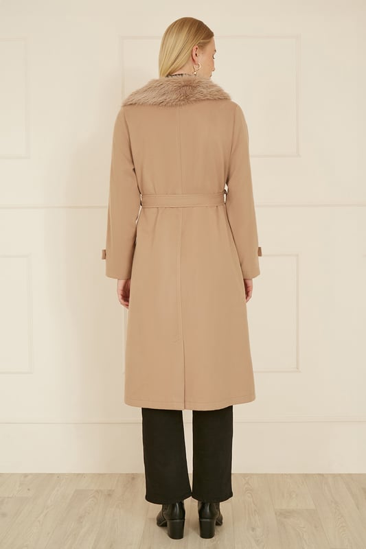 Winter is coming and we couldn't be more excited for coat season! This wrap around beauty with faux fur collar is super versatile, and looks stunning, Pockets and a tie belt ensure this coat is not only chic, but practical too In a midi length to keep you cosy.