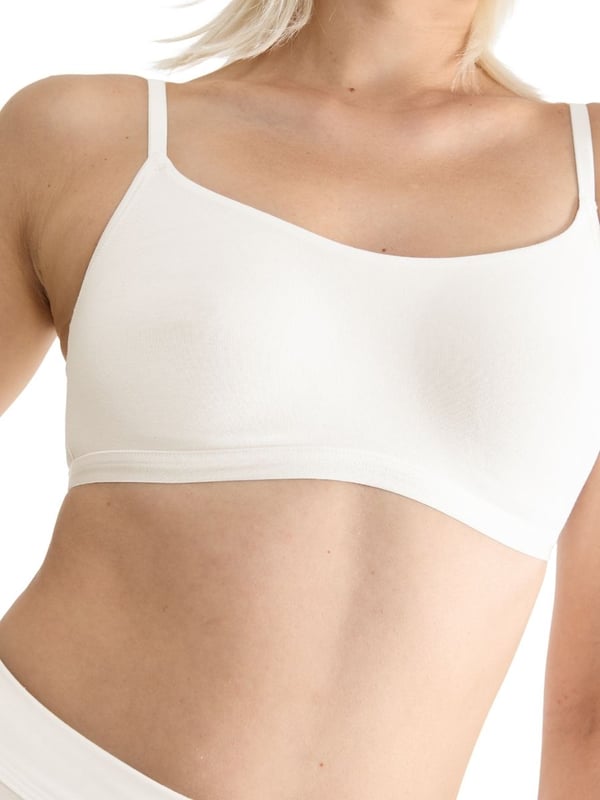 Sloggi GO Daily Cotton Top. The GO Daily Cotton collection uses certified organic cotton for smooth stretchy everyday underwear. Non-wired bralette with pullover design and high cotton content. Product is machine washable.