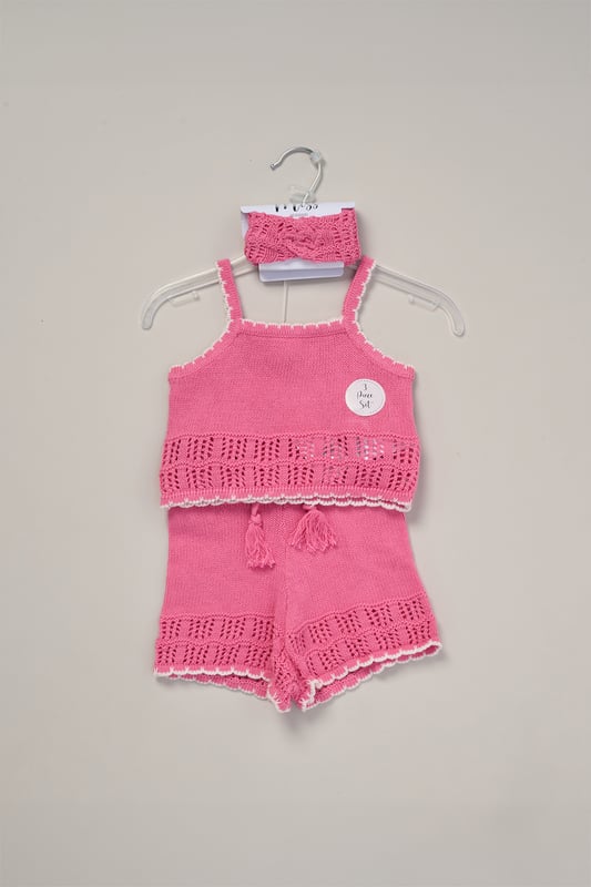 This adorable set by Miss includes a true knit top, comfy shorts, and a matching headband. Perfect for warm days, it combines style and practicality, making it an ideal choice for playdates, outings, or casual summer looks.