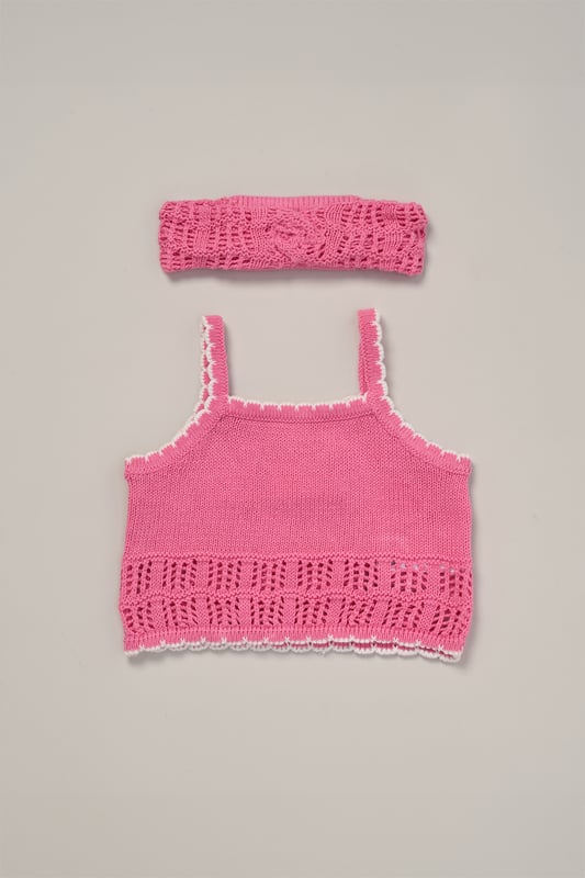 This adorable set by Miss includes a true knit top, comfy shorts, and a matching headband. Perfect for warm days, it combines style and practicality, making it an ideal choice for playdates, outings, or casual summer looks.