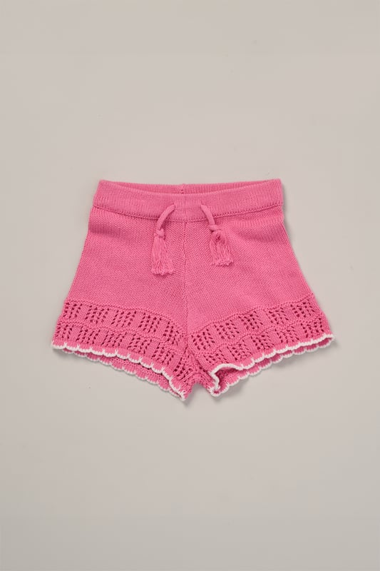 This adorable set by Miss includes a true knit top, comfy shorts, and a matching headband. Perfect for warm days, it combines style and practicality, making it an ideal choice for playdates, outings, or casual summer looks.