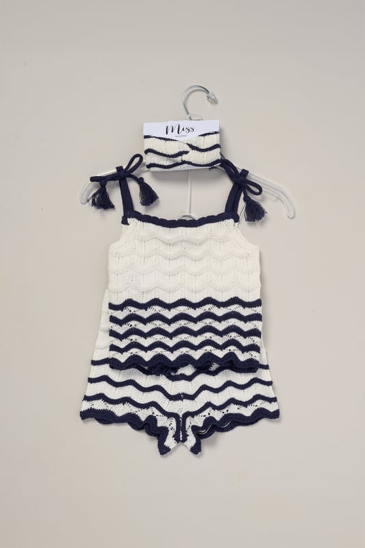This adorable set by Miss includes a true knit top, comfy shorts, and a matching headband. Perfect for warm days, it combines style and practicality, making it an ideal choice for playdates, outings, or casual summer looks.