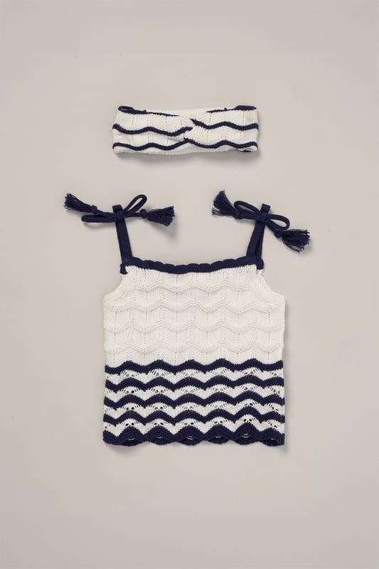 This adorable set by Miss includes a true knit top, comfy shorts, and a matching headband. Perfect for warm days, it combines style and practicality, making it an ideal choice for playdates, outings, or casual summer looks.