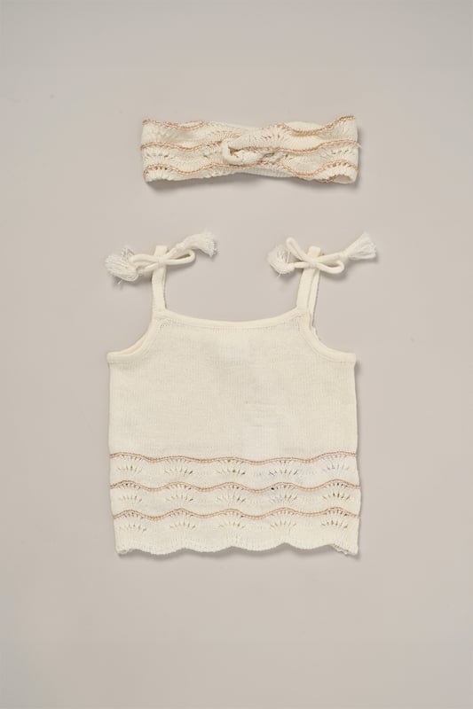 This adorable set by Miss includes a true knit top, comfy shorts, and a matching headband. Perfect for warm days, it combines style and practicality, making it an ideal choice for playdates, outings, or casual summer looks.