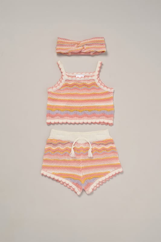 This adorable set by Miss includes a true knit top, comfy shorts, and a matching headband. Perfect for warm days, it combines style and practicality, making it an ideal choice for playdates, outings, or casual summer looks.