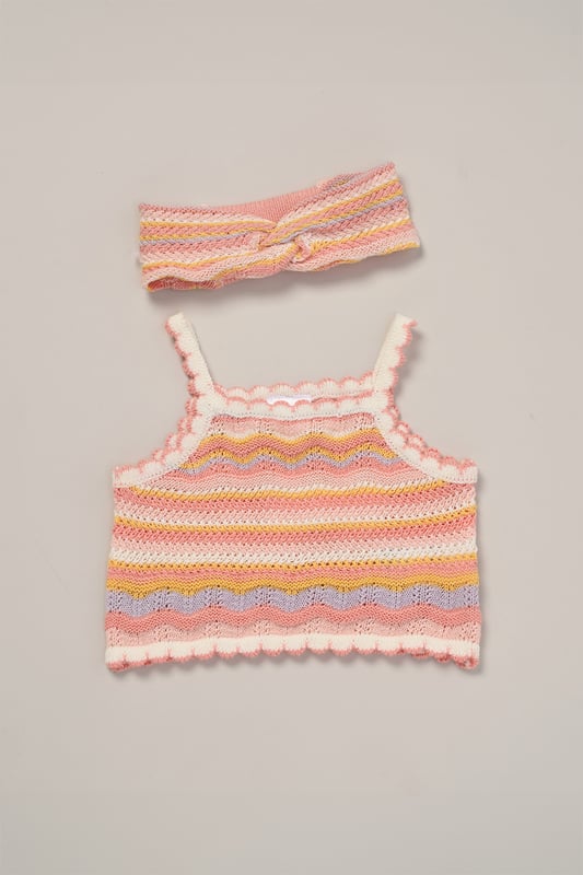 This adorable set by Miss includes a true knit top, comfy shorts, and a matching headband. Perfect for warm days, it combines style and practicality, making it an ideal choice for playdates, outings, or casual summer looks.