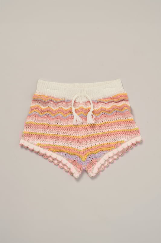 This adorable set by Miss includes a true knit top, comfy shorts, and a matching headband. Perfect for warm days, it combines style and practicality, making it an ideal choice for playdates, outings, or casual summer looks.