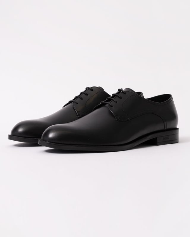 Featuring smooth leather uppers with intricate stitching, these BOSS Menswear Derby shoes are a refined formal touch. Durable heel with embossed logo. 

Laces
Fully lined
Packaging: Box

Upper material: 100% Cow skin, Lining: 50% Polyurethane, 95% Polyester, 50% Polyester, 5% Polyurethane, Sole: 100% Thermoplastic polyurethane, Innersole: 95% Polyester, 5% Polyurethane 
50541701