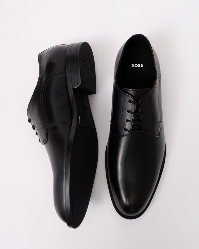 Featuring smooth leather uppers with intricate stitching, these BOSS Menswear Derby shoes are a refined formal touch. Durable heel with embossed logo. 

Laces
Fully lined
Packaging: Box

Upper material: 100% Cow skin, Lining: 50% Polyurethane, 95% Polyester, 50% Polyester, 5% Polyurethane, Sole: 100% Thermoplastic polyurethane, Innersole: 95% Polyester, 5% Polyurethane 
50541701