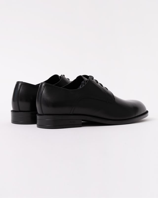 Featuring smooth leather uppers with intricate stitching, these BOSS Menswear Derby shoes are a refined formal touch. Durable heel with embossed logo. 

Laces
Fully lined
Packaging: Box

Upper material: 100% Cow skin, Lining: 50% Polyurethane, 95% Polyester, 50% Polyester, 5% Polyurethane, Sole: 100% Thermoplastic polyurethane, Innersole: 95% Polyester, 5% Polyurethane 
50541701