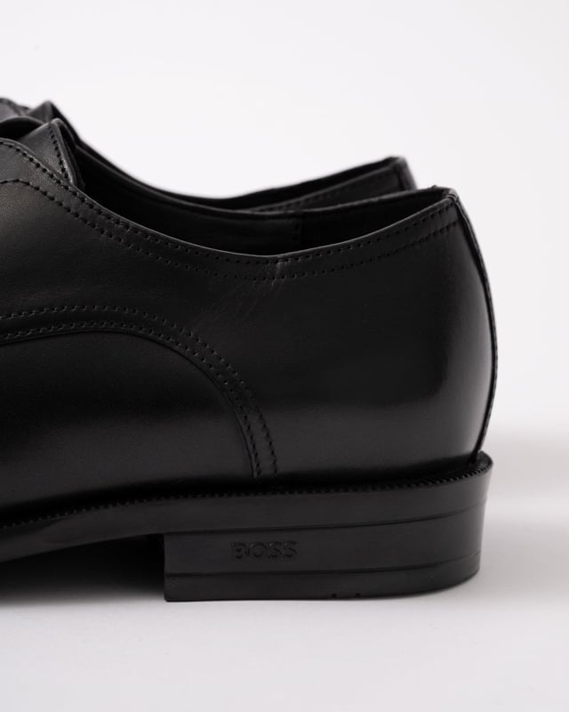 Featuring smooth leather uppers with intricate stitching, these BOSS Menswear Derby shoes are a refined formal touch. Durable heel with embossed logo. 

Laces
Fully lined
Packaging: Box

Upper material: 100% Cow skin, Lining: 50% Polyurethane, 95% Polyester, 50% Polyester, 5% Polyurethane, Sole: 100% Thermoplastic polyurethane, Innersole: 95% Polyester, 5% Polyurethane 
50541701