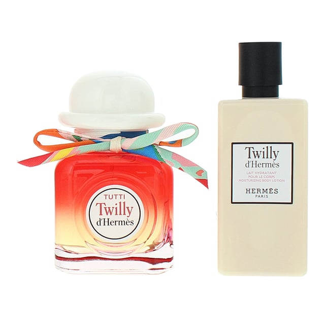 Hermes Twilly D'Hermes Tutti 2 Piece Gift Set includes the elegant Eau De Parfum and a nourishing Moisturizing Body Lotion. The fragrance is a vibrant and playful blend of litchi at the top, bringing a fresh, fruity sweetness. The heart reveals the delicate and spicy essence of ginger flower, which adds warmth and depth. Finally, the base is rounded off with musk, providing a soft, sensual finish. This set offers a full sensory experience, with the body lotion complementing the fragrance by leaving your skin feeling smooth and delicately scented, perfect for daily wear.